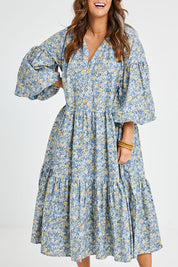 Model Laura wearing size 14 of the Light Of The Sun Cotton Dress in colour Bluefleur (Blue), from the front, cropped image