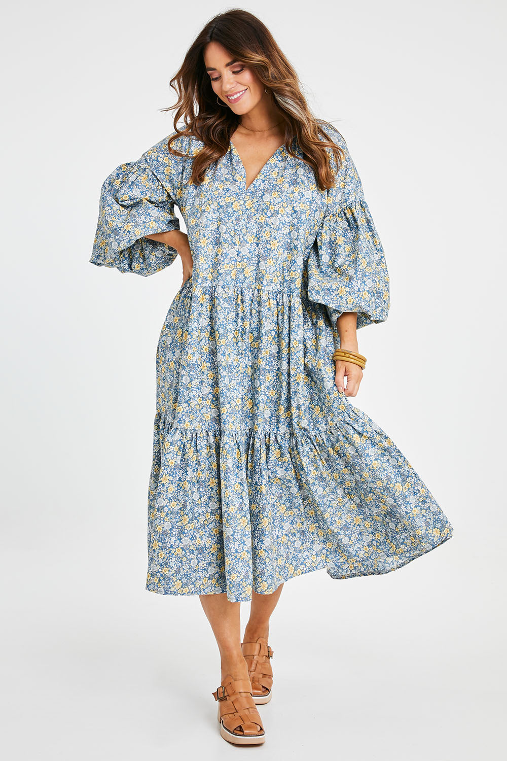 Model Laura wearing size 14 of the Light Of The Sun Cotton Dress in colour Bluefleur (Blue), from the front, showing the whole outfit
