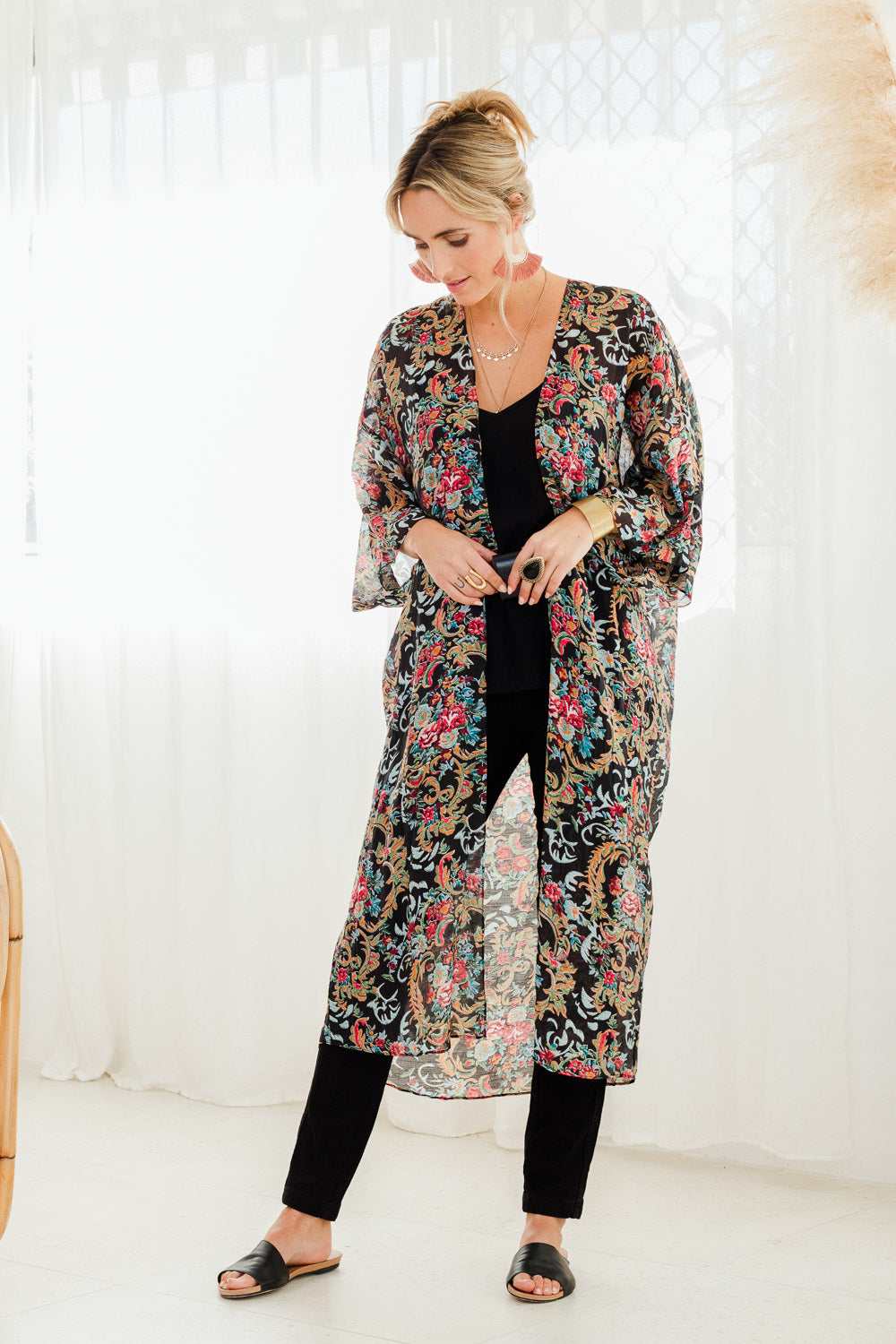 Model Tegan wearing size 10 of the Secret Garden Kimono in colour Blackfleur (Black), from the front, showing the whole outfit