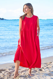 Model Tegan wearing size 10 of the A Cloudless Day Dress in colour Red (Red), from the front, showing the whole outfit