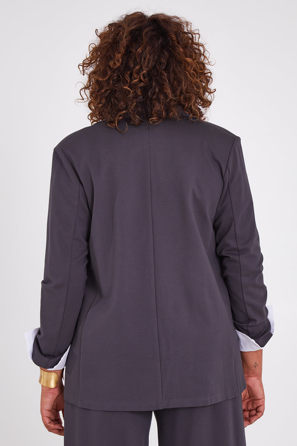 Model Anucia wearing size 14 of the Keeping It Cool Oversized Boyfriend Blazer in colour Castle (Grey), from the back