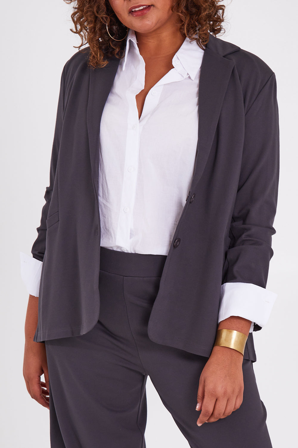 Model Anucia wearing size 14 of the Keeping It Cool Oversized Boyfriend Blazer in colour Castle (Grey), from the front, cropped image