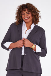 Model Anucia wearing size 14 of the Keeping It Cool Oversized Boyfriend Blazer in colour Castle (Grey), from the front, cropped image