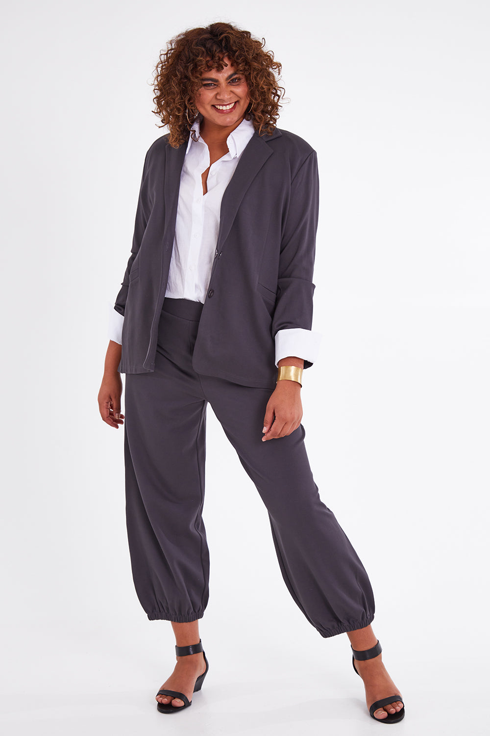 Model Anucia wearing size 14 of the Keeping It Cool Oversized Boyfriend Blazer in colour Castle (Grey), from the front, showing the whole outfit
