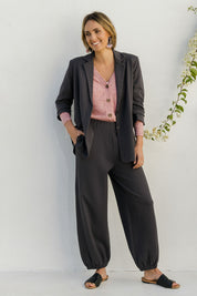 Model Tegan wearing size 10 of the Keeping It Cool Oversized Boyfriend Blazer in colour Castle (Grey), from the front, showing the whole outfit
