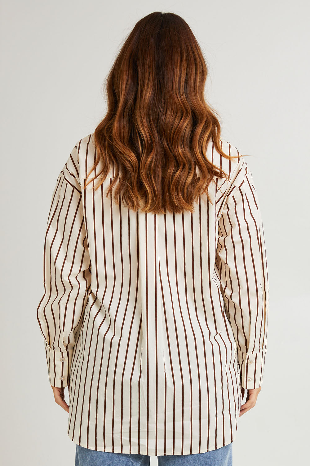 Model Laura wearing size 14 of the Relaxed Elegance Boyfriend Shirt in colour Chocstripe, from the back