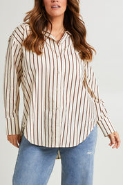 Model Laura wearing size 14 of the Relaxed Elegance Boyfriend Shirt in colour Chocstripe, from the front, cropped image