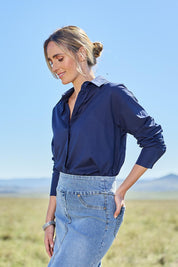 Model Tegan wearing size 10 of the Relaxed Elegance Boyfriend Shirt in colour Inknavy (Blue), from the front, showing the whole outfit