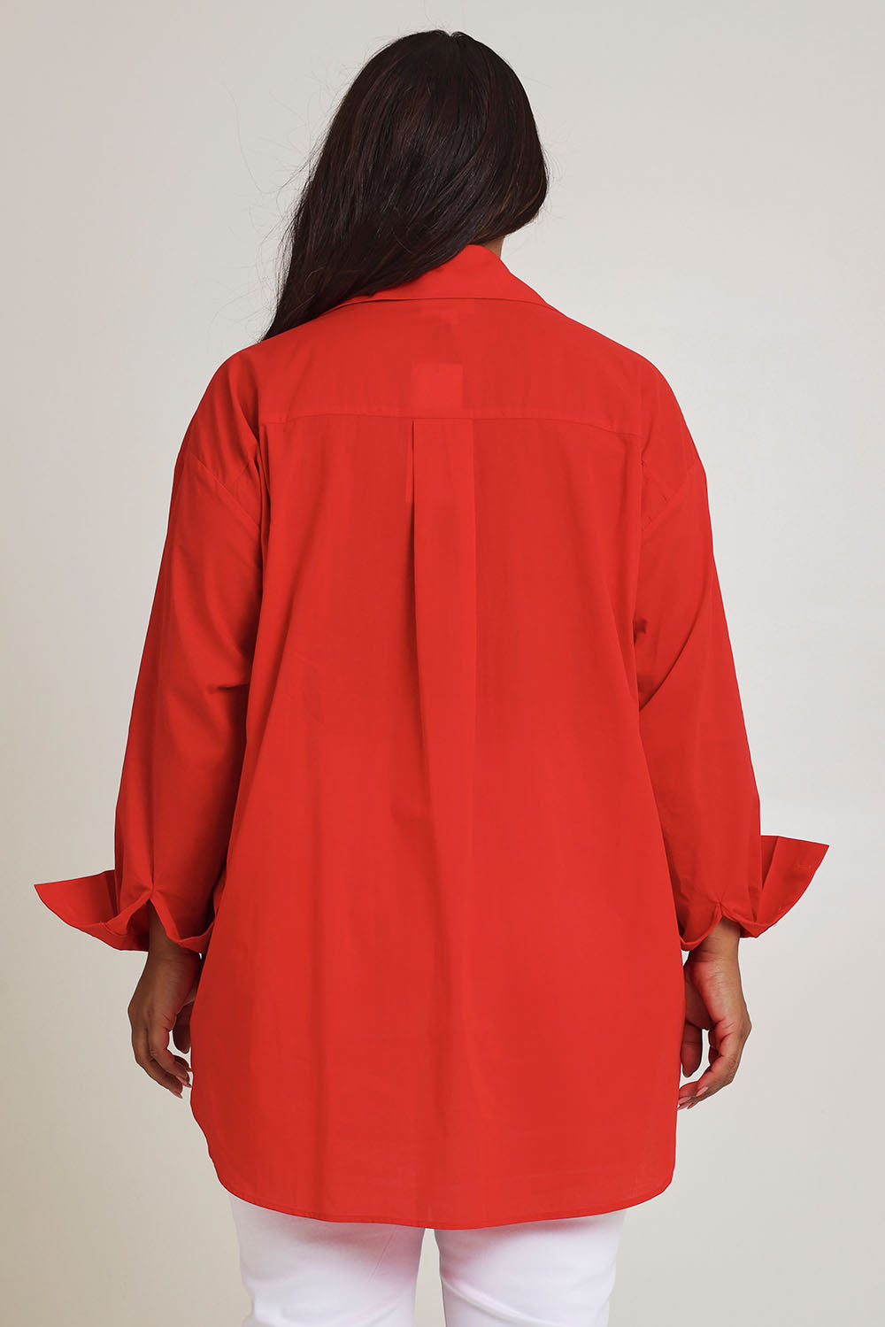 Model Ashleigh wearing size 16 of the Relaxed Elegance Boyfriend Shirt in colour Red (Red), from the back