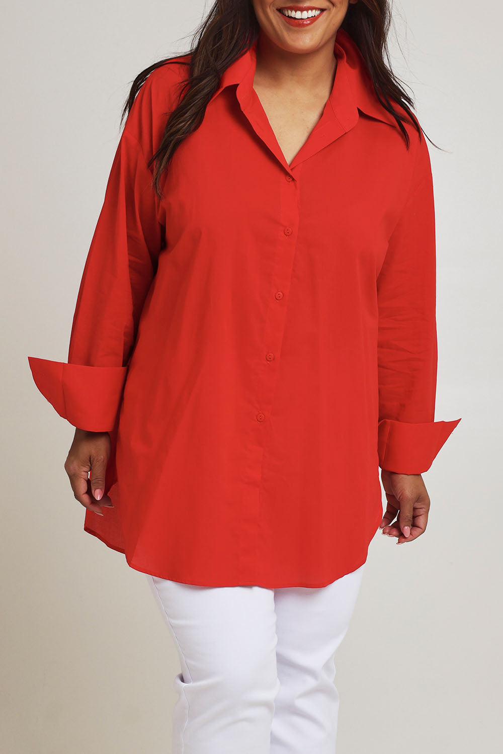 Model Ashleigh wearing size 16 of the Relaxed Elegance Boyfriend Shirt in colour Red (Red), from the front, cropped image