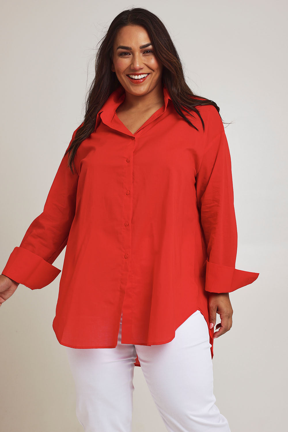 Model Ashleigh wearing size 16 of the Relaxed Elegance Boyfriend Shirt in colour Red (Red), from the front, cropped image