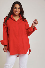 Model Ashleigh wearing size 16 of the Relaxed Elegance Boyfriend Shirt in colour Red (Red), from the front, cropped image
