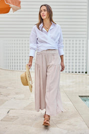 Model Tegand wearing size 10 of the Relaxed Elegance Cotton Boyfriend Shirt - White in colour White, from the front