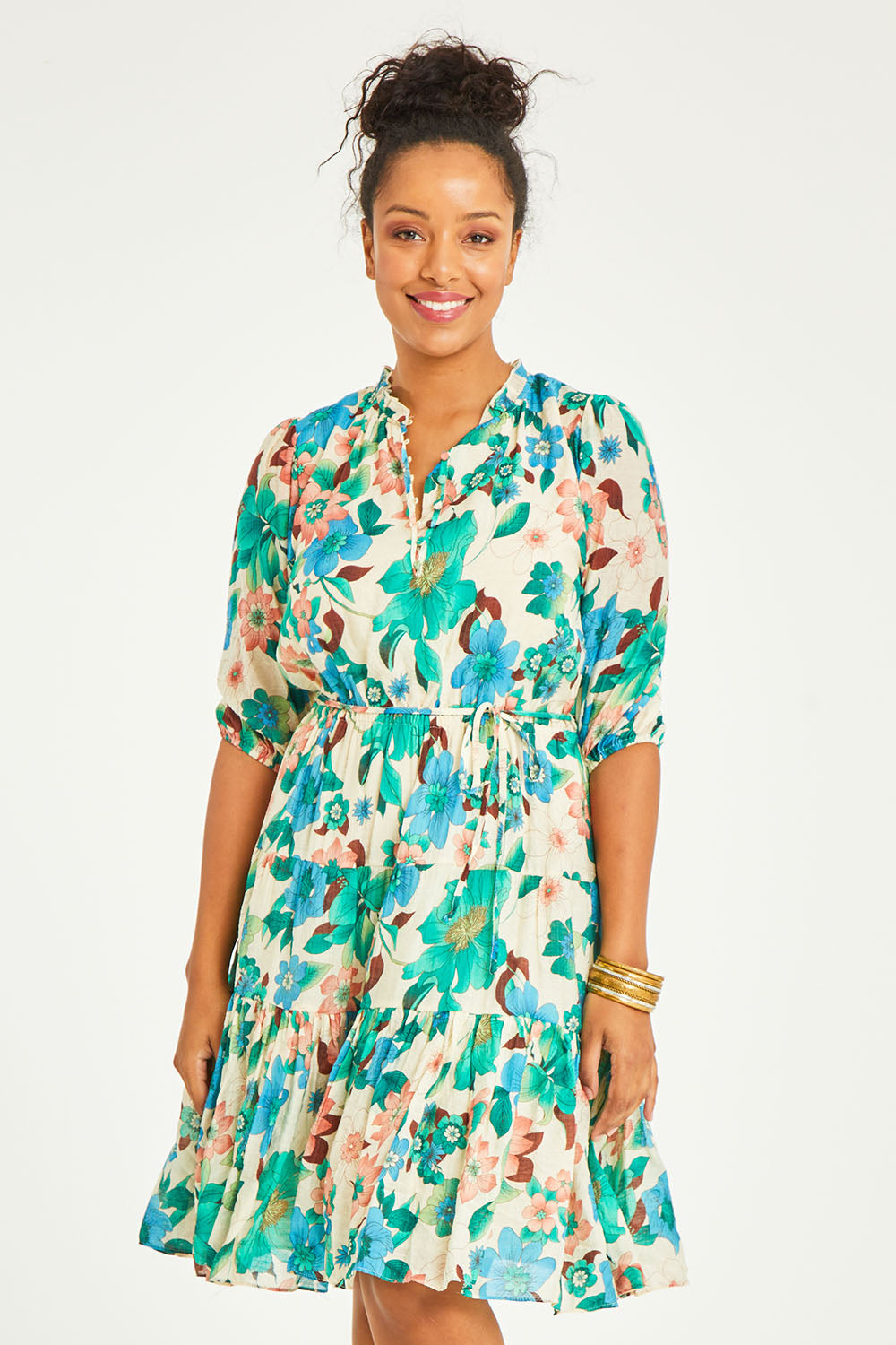 Model Noli wearing size 14 of the Sweet As Sugar Dress in colour Fleurblue (Blue), from the front, cropped image
