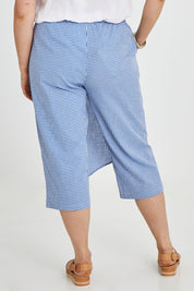 Model Keeara wearing size 16 of the Honeypie Cotton Overlay Pants in colour Blue (Blue), from the back