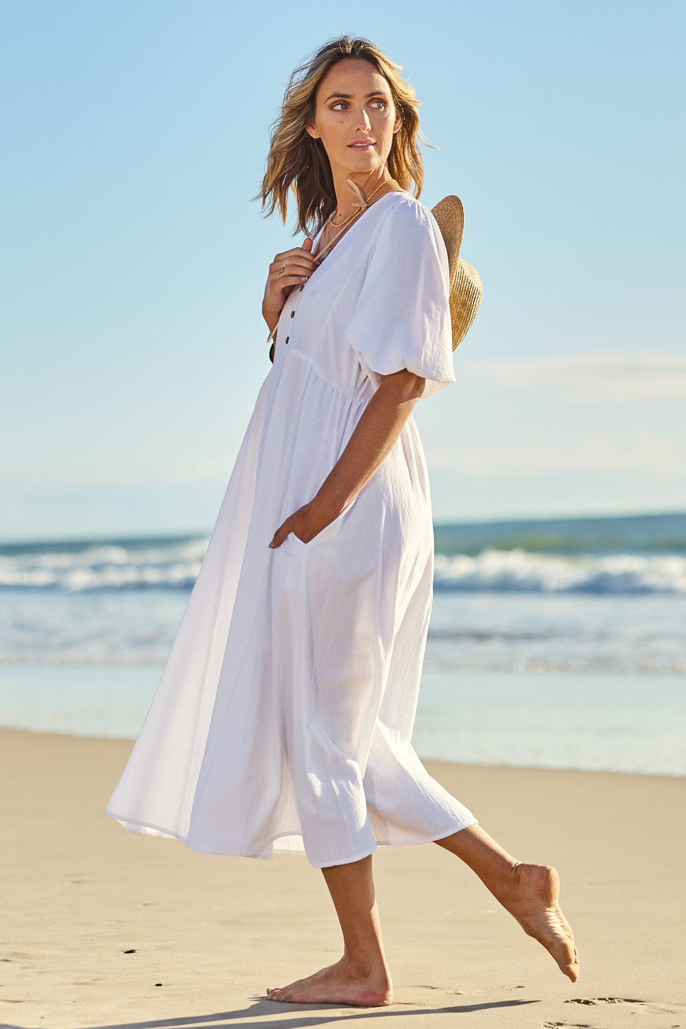 Model Tegan wearing size 10 of the Summer Picnic Smock Dress in colour White (White), from the front, showing the whole outfit