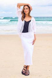 Model Tegan wearing size 10 of the Easy As Pull On Denim Skirt in colour White (White), from the front, showing the whole outfit