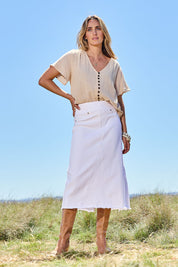 Model Tegan wearing size 10 of the Easy As Pull On Denim Skirt in colour White (White), from the front, showing the whole outfit