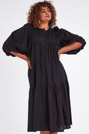 Model Anucia wearing size 14 of the Picture Perfect Linen Dress in colour Black (Black), from the front, cropped image