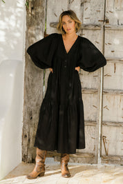 Model Tegan wearing size 10 of the Picture Perfect Linen Dress in colour Black (Black), from the front, showing the whole outfit