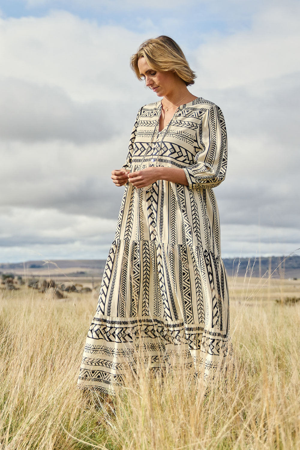 Model Tegan wearing size 10 of the Forever Favourite Cotton Maxi Dress in colour Blackstrip, from the front, showing the whole outfit