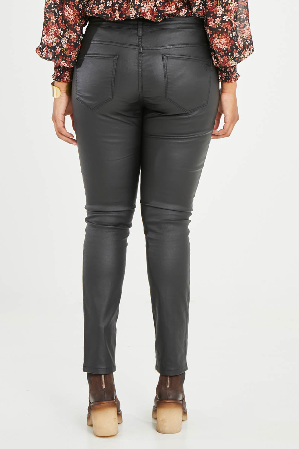 Model Noli wearing size 14 of the Hot Stuff Coated Jean in colour Black (Black), from the back
