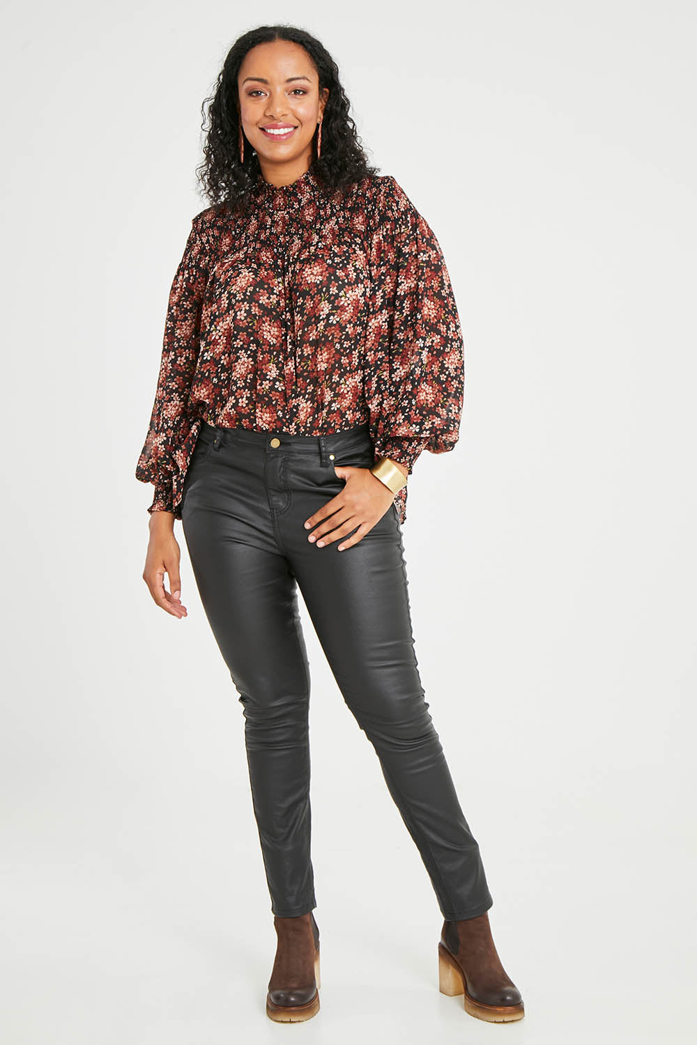 Model Noli wearing size 14 of the Hot Stuff Coated Jean in colour Black (Black), from the front, showing the whole outfit