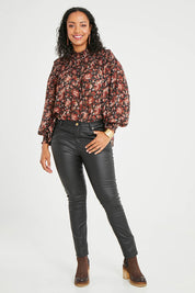 Model Noli wearing size 14 of the Hot Stuff Coated Jean in colour Black (Black), from the front, showing the whole outfit