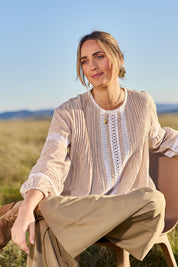 Model Tegan wearing size 10 of the At My Best Button Back Blouse in colour Natstripe, from the front, showing the whole outfit