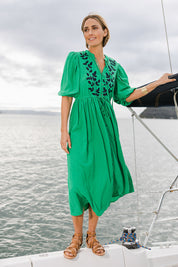 Model Tegan wearing size 10 of the For Love And Dancing Dress in colour Emerald (Green), from the front, showing the whole outfit