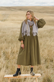 Model Tegan wearing size 10 of the For Love And Dancing Dress in colour Khaki (Green), from the front, showing the whole outfit