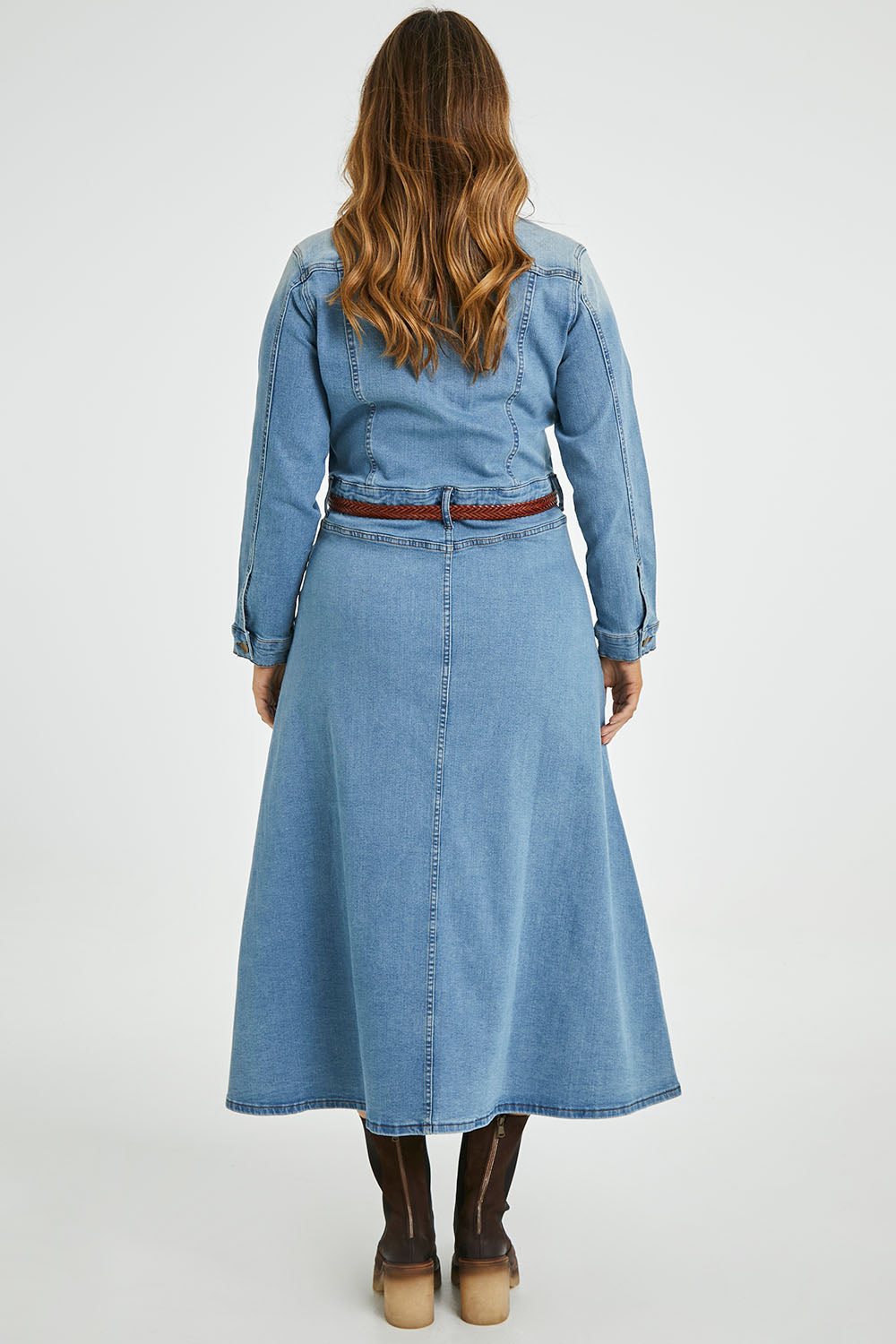 Model Laura wearing size 14 of the Calamity Denim Maxi Dress in colour Denim (Blue), from the back