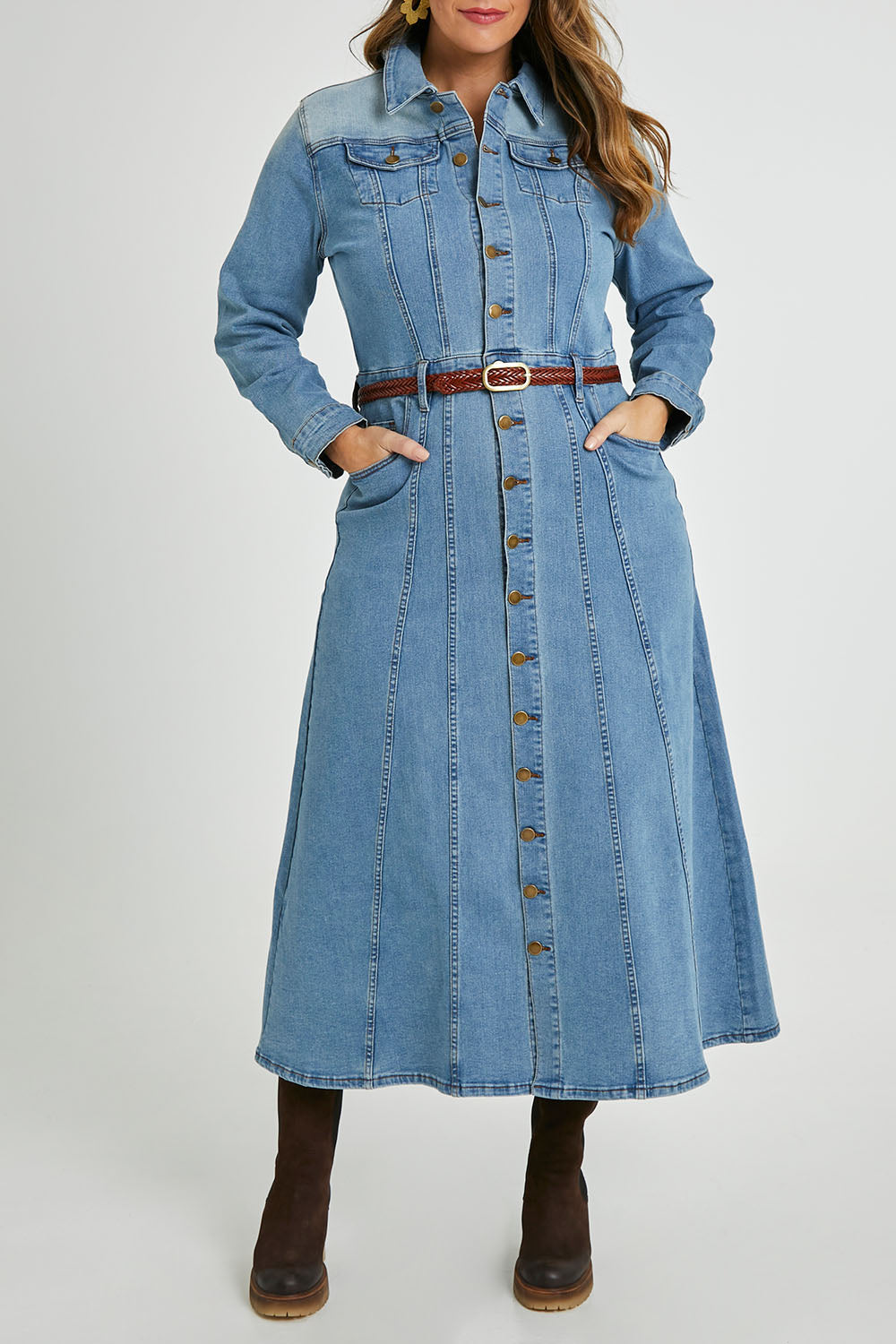 Model Laura wearing size 14 of the Calamity Denim Maxi Dress in colour Denim (Blue), from the front, cropped image