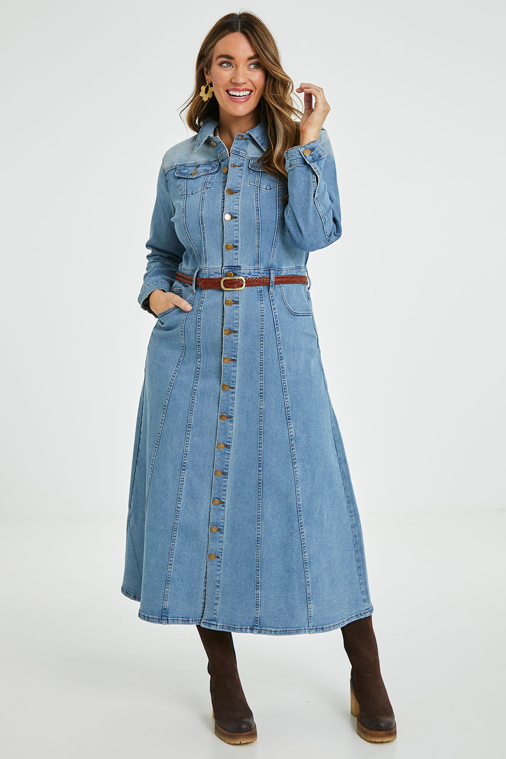 Model Laura wearing size 14 of the Calamity Denim Maxi Dress in colour Denim (Blue), from the front, showing the whole outfit