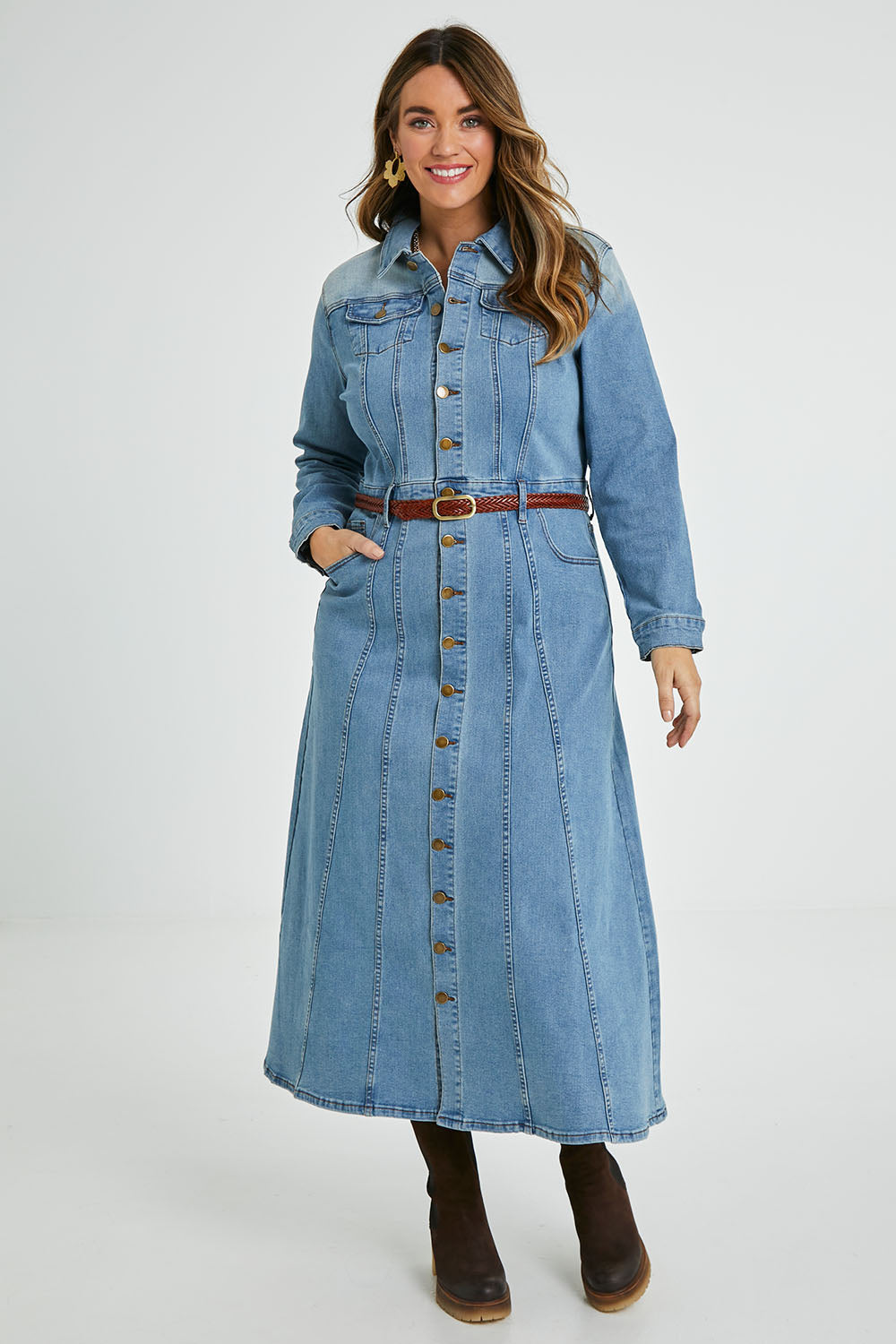 Model Laura wearing size 14 of the Calamity Denim Maxi Dress in colour Denim (Blue), from the front, showing the whole outfit