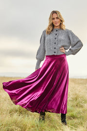 Model Tegan wearing size 10 of the Love By Candlelight Velvet Skirt in colour Mulberry (Pink), from the front, showing the whole outfit