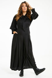 Model Laura wearing size 14 of the Feeling Super Fine Jumpsuit in colour Black (Black), from the front, showing the whole outfit