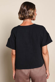 Model Riinar wearing size 10 of the Every Other Day Cotton Blouse – Black in colour Black, from an angle