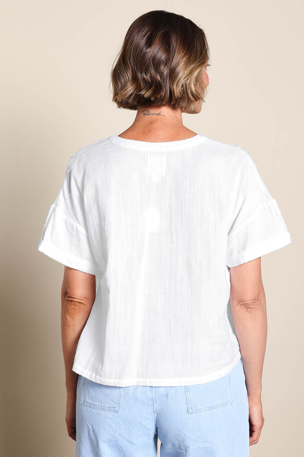 Model Riinar wearing size 10 of the Every Other Day Cotton Blouse – White in colour White, from the back