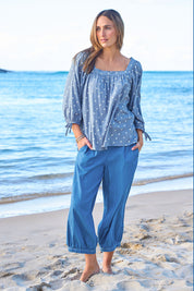 Model Tegan wearing size 10 of the Picking Flowers Blouse in colour Bluehue (Blue), from the front, showing the whole outfit
