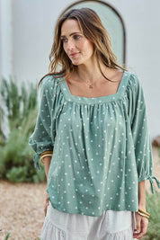 Model Tegand wearing size 10 of the Picking Flowers Blouse – Sagehue in colour Sagehue, in a cropped view