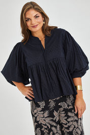 Model Monique wearing size 14 of the Happy Hour Dobby Blouse in colour Black (Black), from the front, cropped image