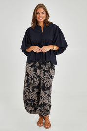 Model Monique wearing size 14 of the Happy Hour Dobby Blouse in colour Black (Black), from the front, showing the whole outfit
