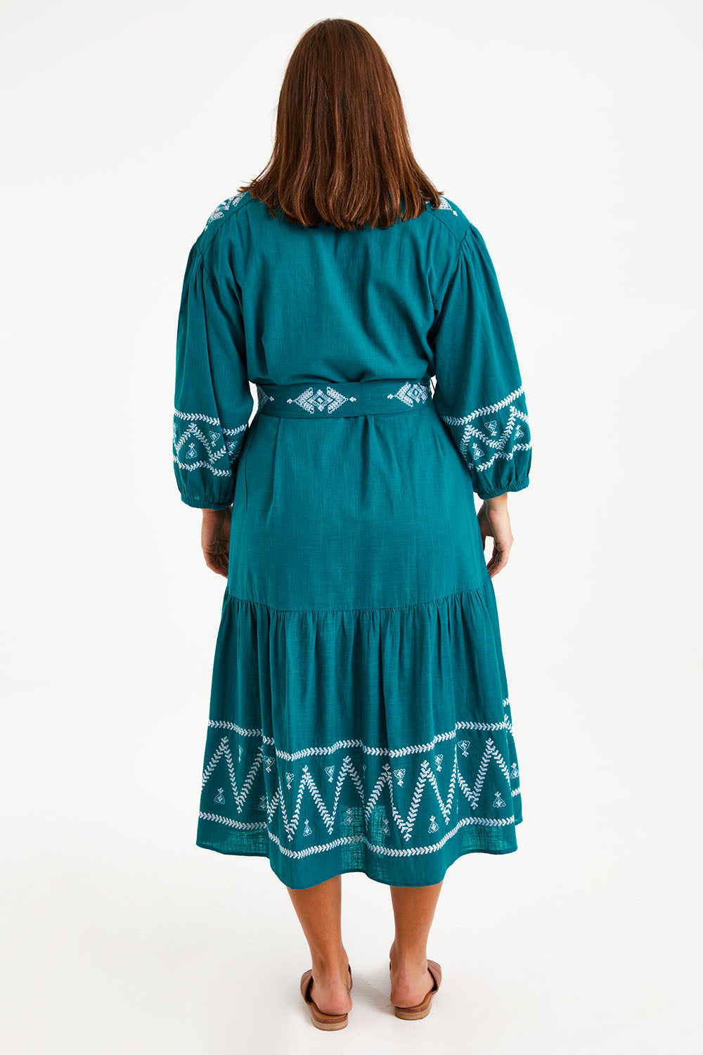 Model Monique wearing size 14 of the Spring Fling Embroidered Dress in colour Jade (Green), from the back
