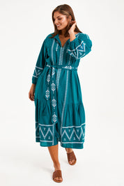 Model Monique wearing size 14 of the Spring Fling Embroidered Dress in colour Jade (Green), from the front, showing the whole outfit