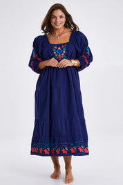 Model Monique wearing size 14 of the Picnic In The Fields Embroidered Dress in colour Navycombo (Blue), from the front, showing the whole outfit