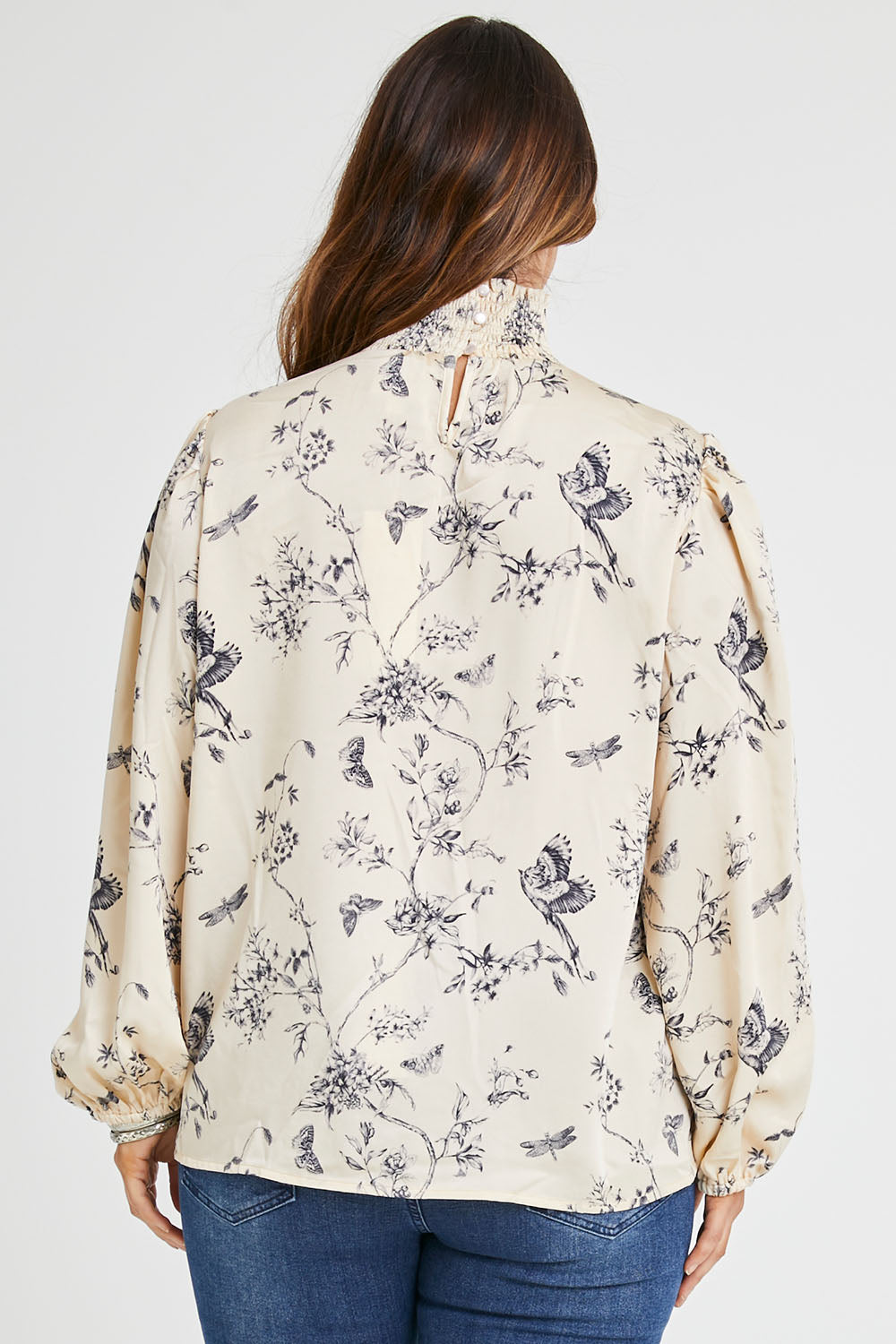 Model Laura wearing size 14 of the Teatime And Flowers Blouse in colour Cream (White), from the back