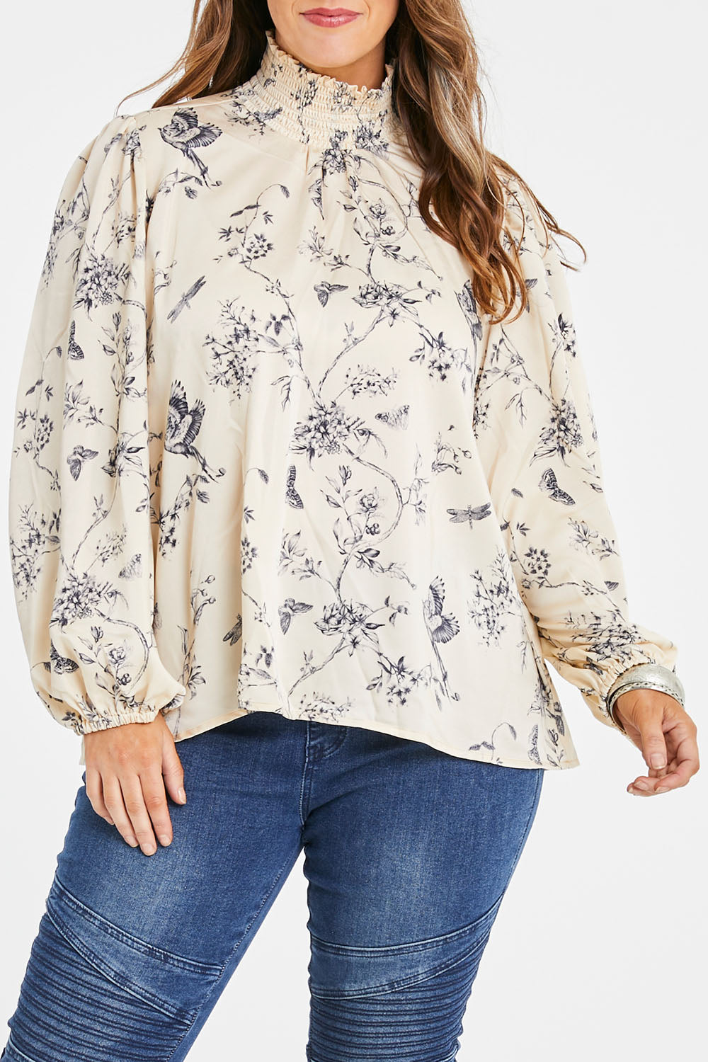 Model Laura wearing size 14 of the Teatime And Flowers Blouse in colour Cream (White), from the front, cropped image