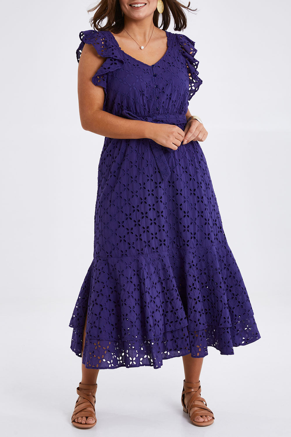 Model Monique wearing size 14 of the Beauty In Broderie Dress in colour Navy (Blue), from the front, cropped image