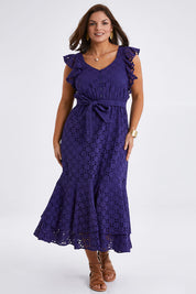 Model Monique wearing size 14 of the Beauty In Broderie Dress in colour Navy (Blue), from the front, showing the whole outfit